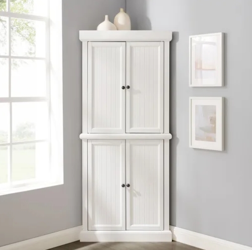 white corner cabinet with doors